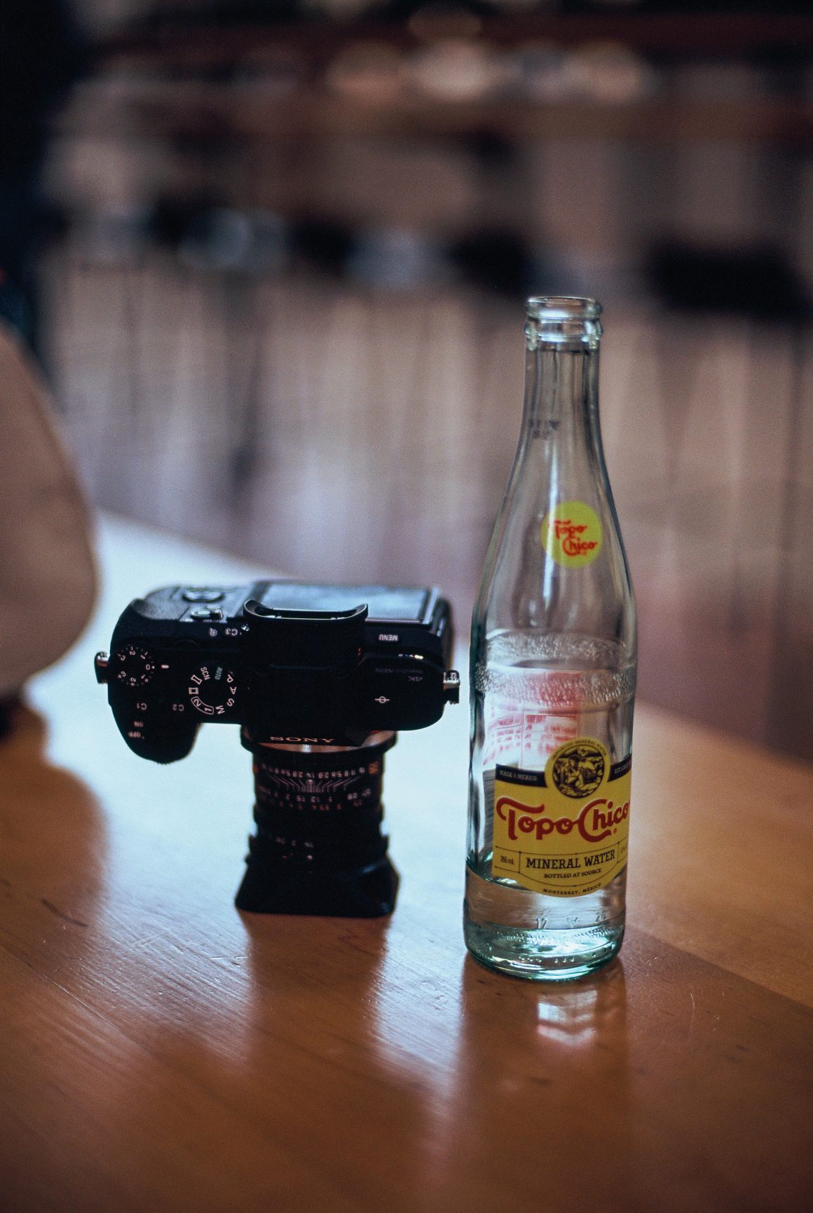 Leica lens Topo-Chico bottle