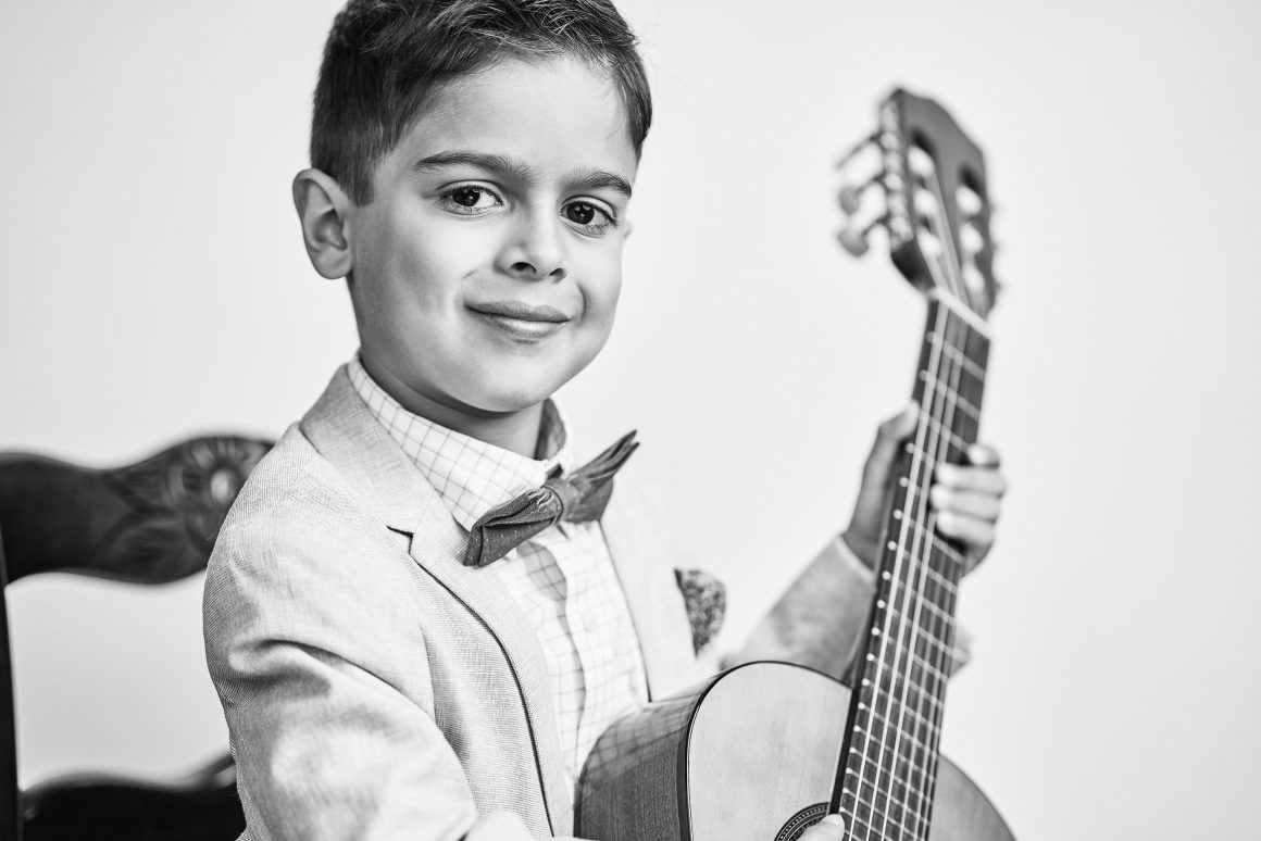 young boy with guitar