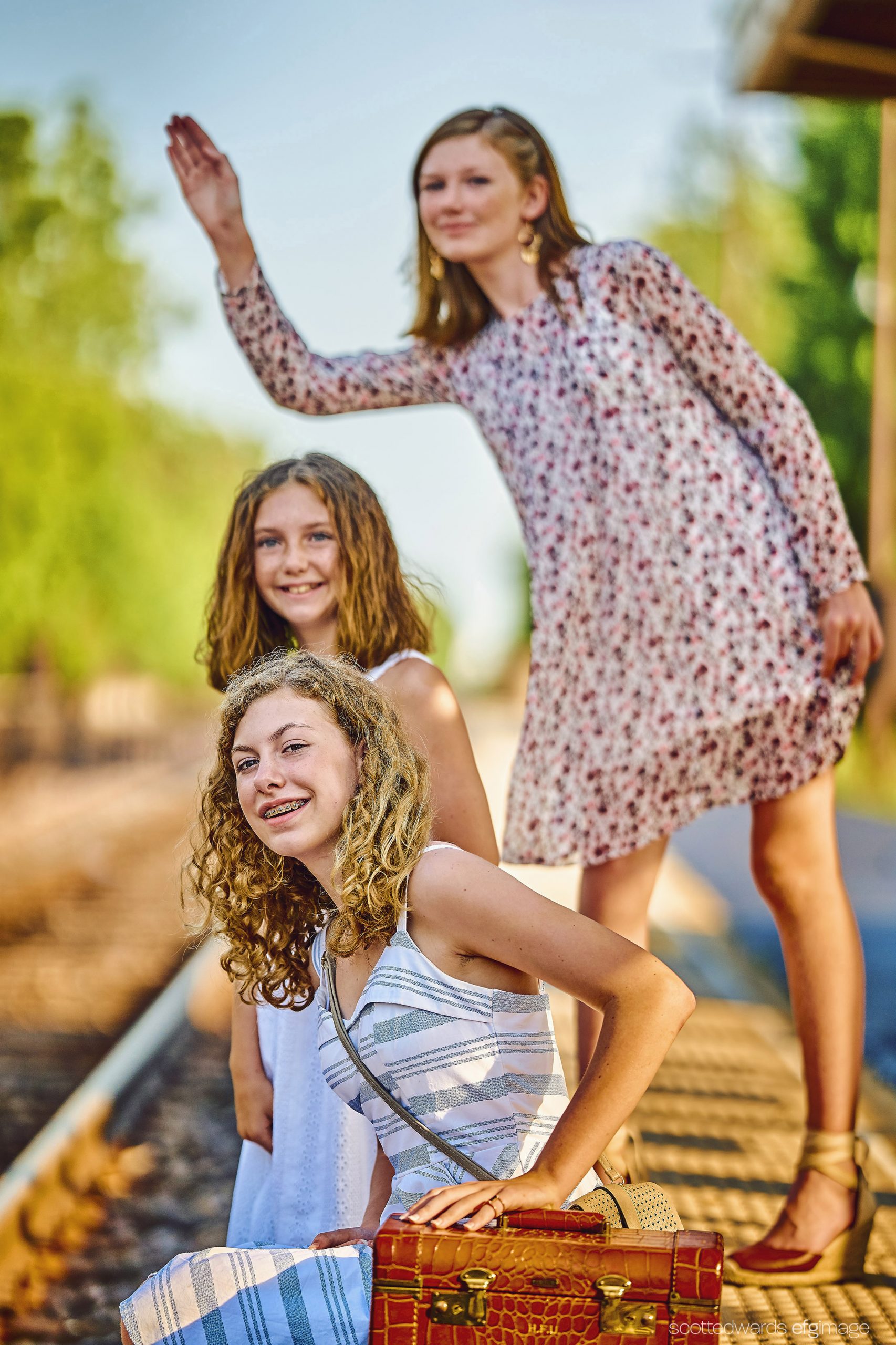 young girls by train tracks