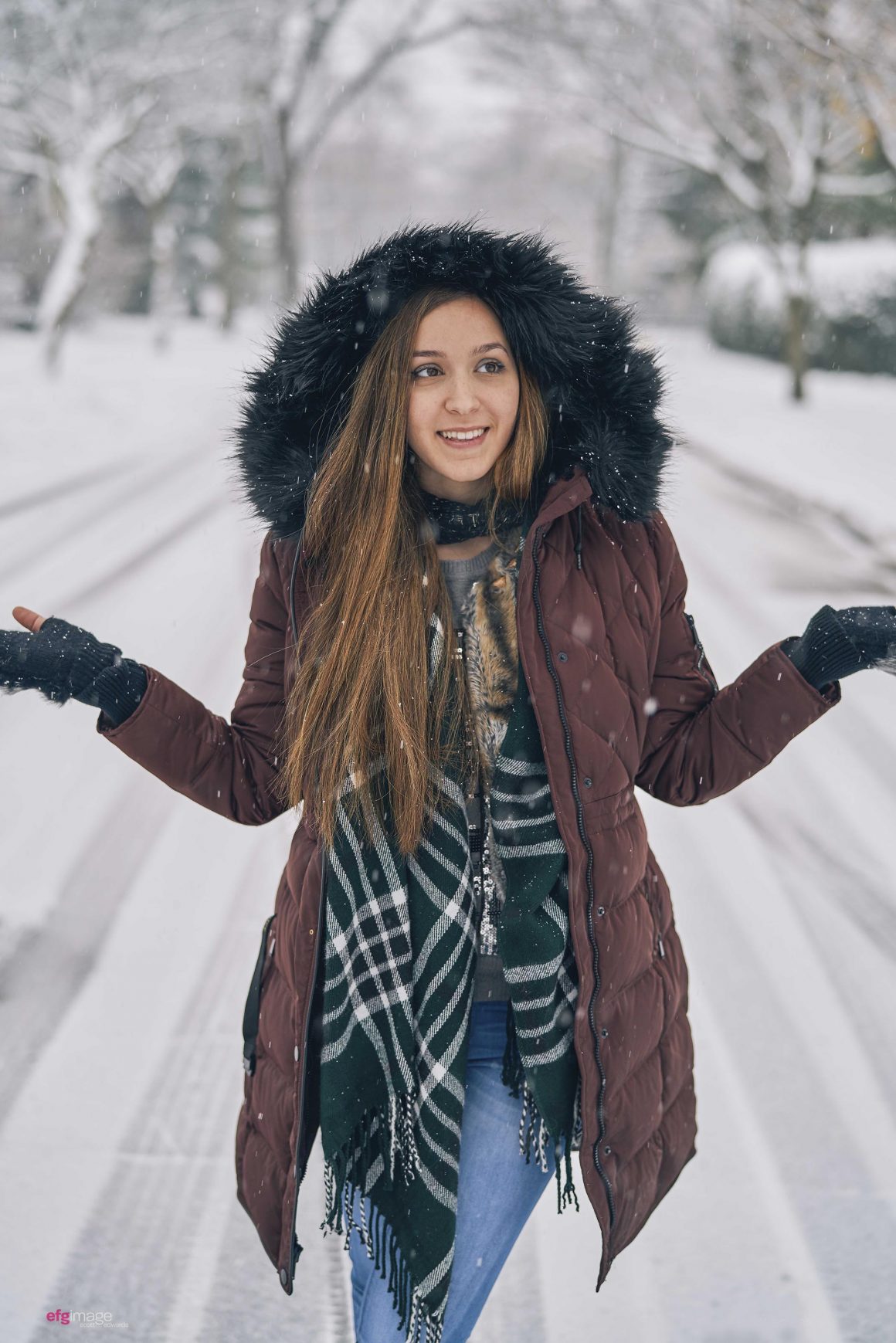 cute girl in street of snow