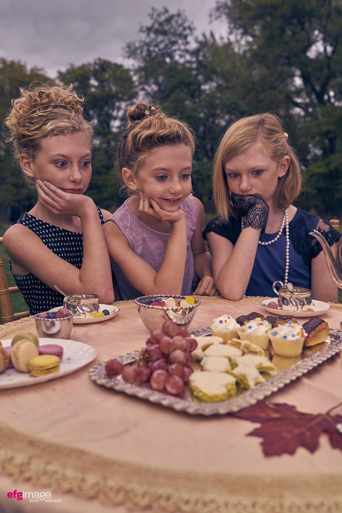 tea party beautiful young sisters with desserts
