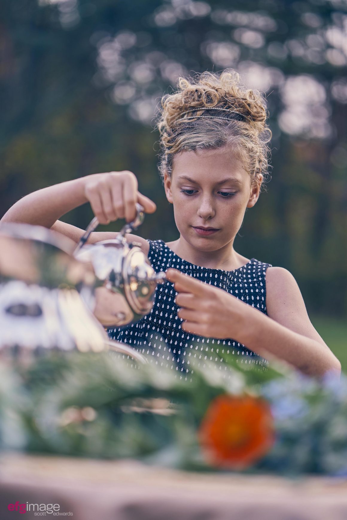 young girl with teapot
