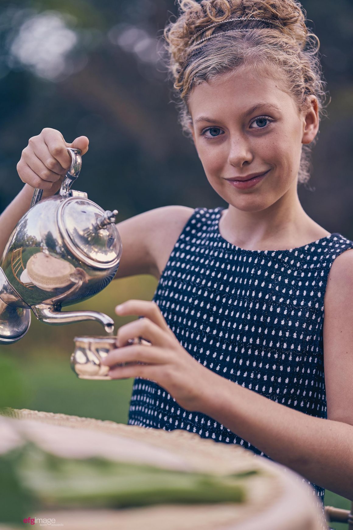 young girl with tea pot