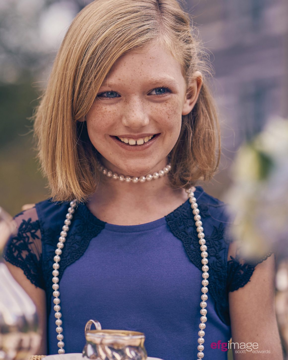young girl with pearls