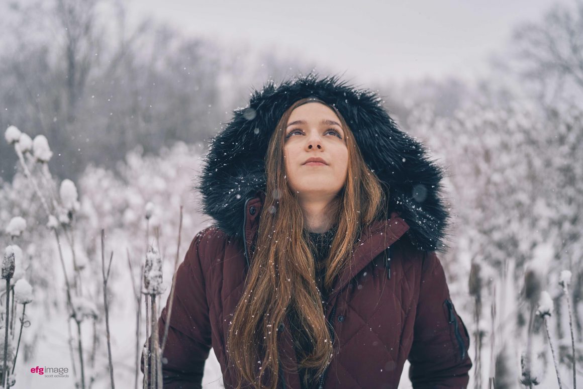 beautiful girl in field of snow